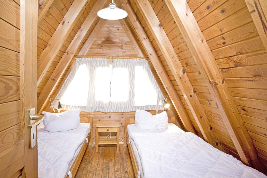 Foto von einem Schlafzimmer im Obergeschoss des Nurdachhauses 304