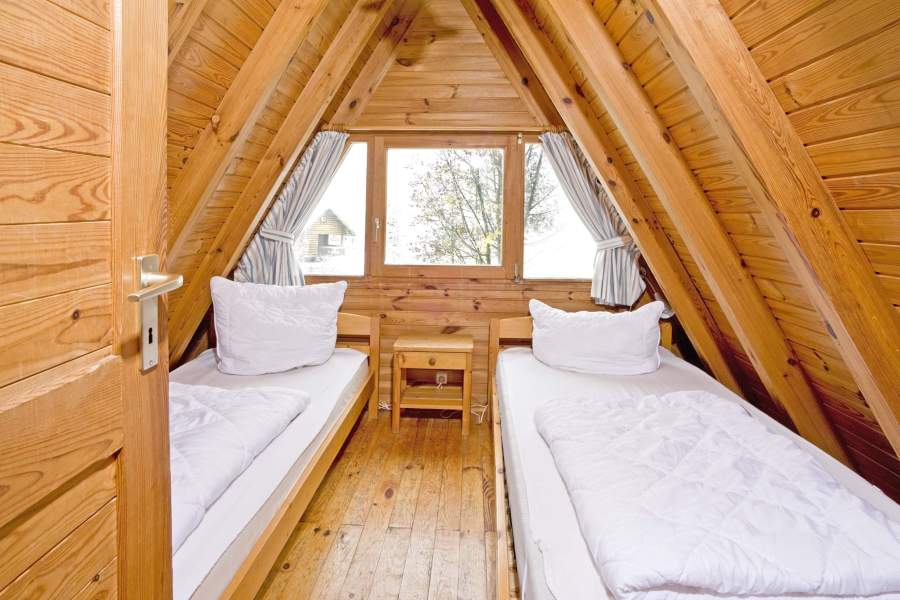 Foto von einem Schlafzimmer mit Einzelbetten im Nurdachhaus 337.