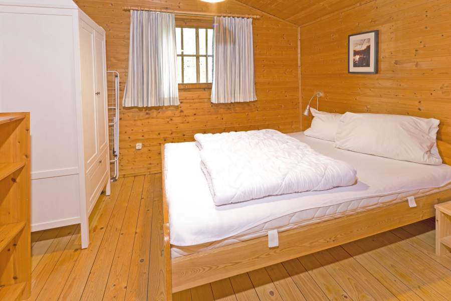 Foto von dem Schlafzimmer mit Doppelbett im Ferienhaus 361.