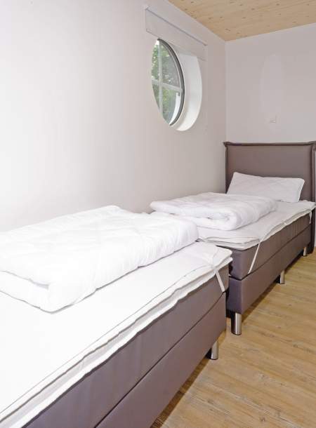 Foto von dem Schlafzimmer mit Einzelbetten in der Seewohnung 413.