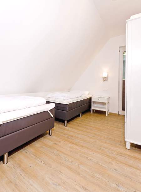 Foto von dem Schlafzimmer mit Einzelbetten in der Seewohnung 414.