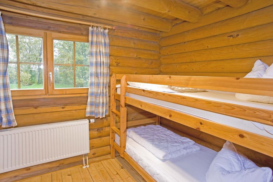 Foto von dem Schlafzimmer mit Etagenbett im Blockhaus 330.