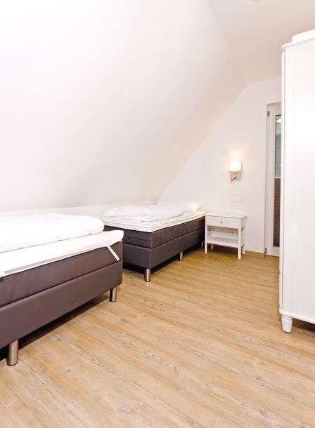 Foto von dem Schlafzimmer mit Einzelbetten in der Seewohnung 414.